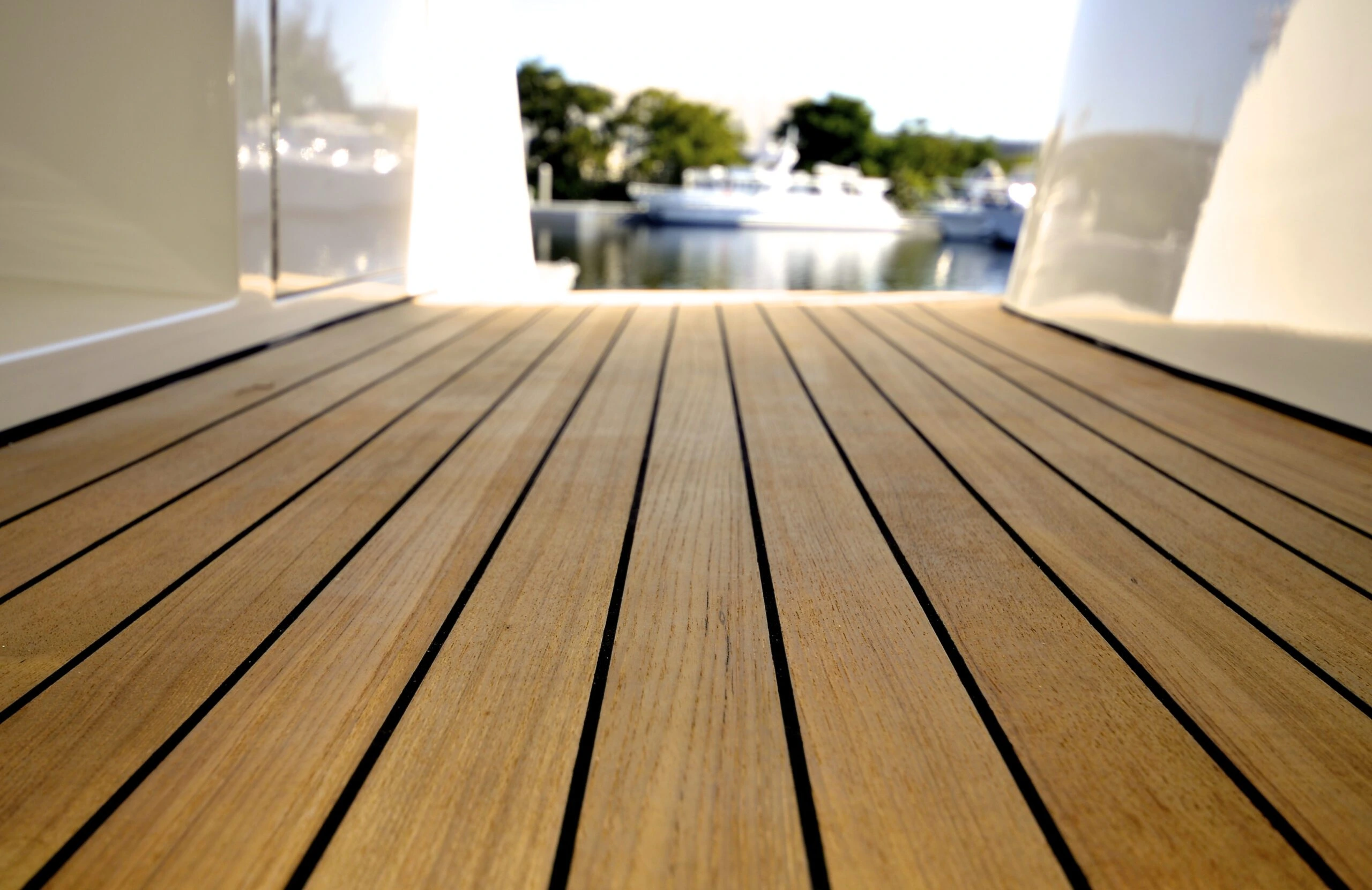 Wood planks serving as the teak decking of the yacht.